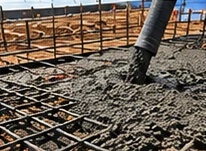 Hose pouring concrete into rebar