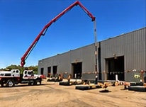 Boom pump at an industrial warehouse
