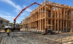 Pumping concrete at a multi-family framing site