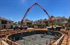 Boom pump over a pool excavation